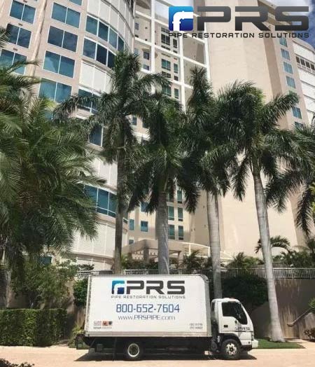 PRS Plumbing Truck investigation a plumbing issue at a condo building